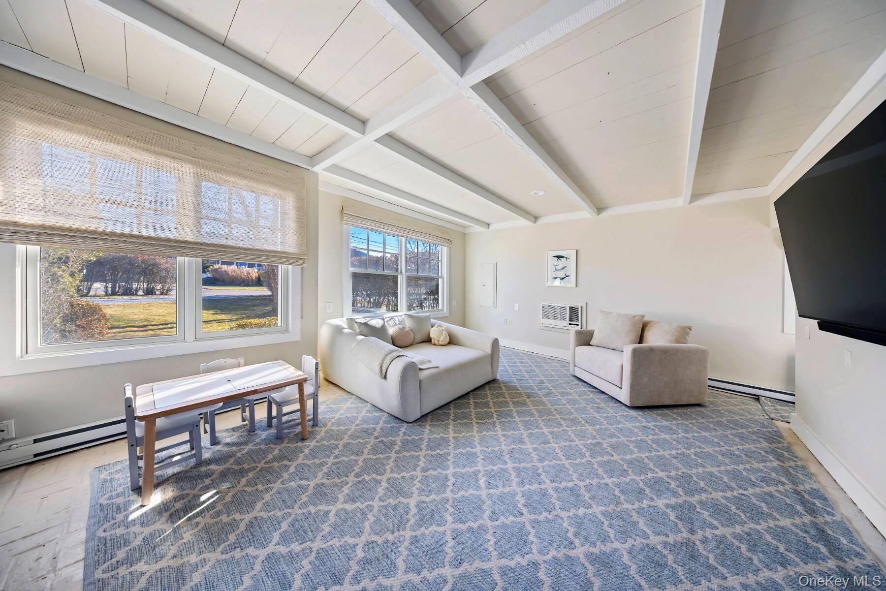 30 Exchange Place Westhampton Beach, NY 11978 - Photo 7 of 25 a living room with furniture and a flat screen tv
