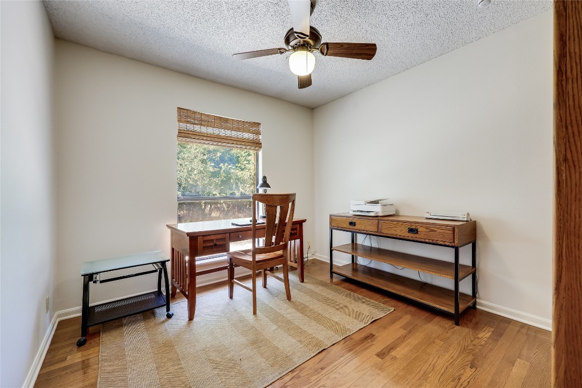 6015 Tonkowa Trail Georgetown, TX 78628 - Photo 20 of 40 a view of a workspace with furniture and a window