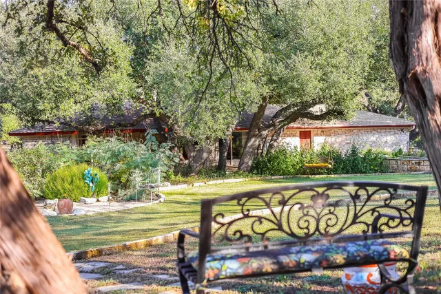 a view of swimming pool with a yard