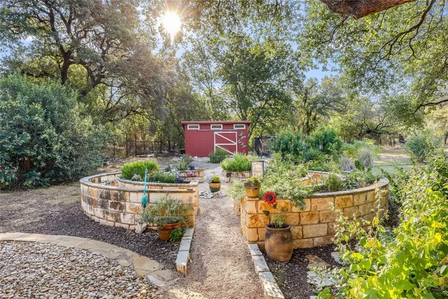 a view of a back yard of the house and a garden
