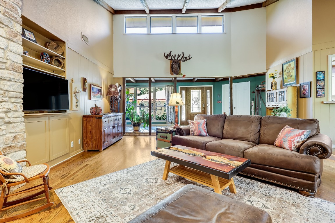6015 Tonkowa Trail Georgetown, TX 78628 - Photo 7 of 40 a living room with furniture and a flat screen tv