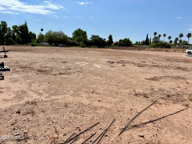 a front view of a house with a garden and pathway