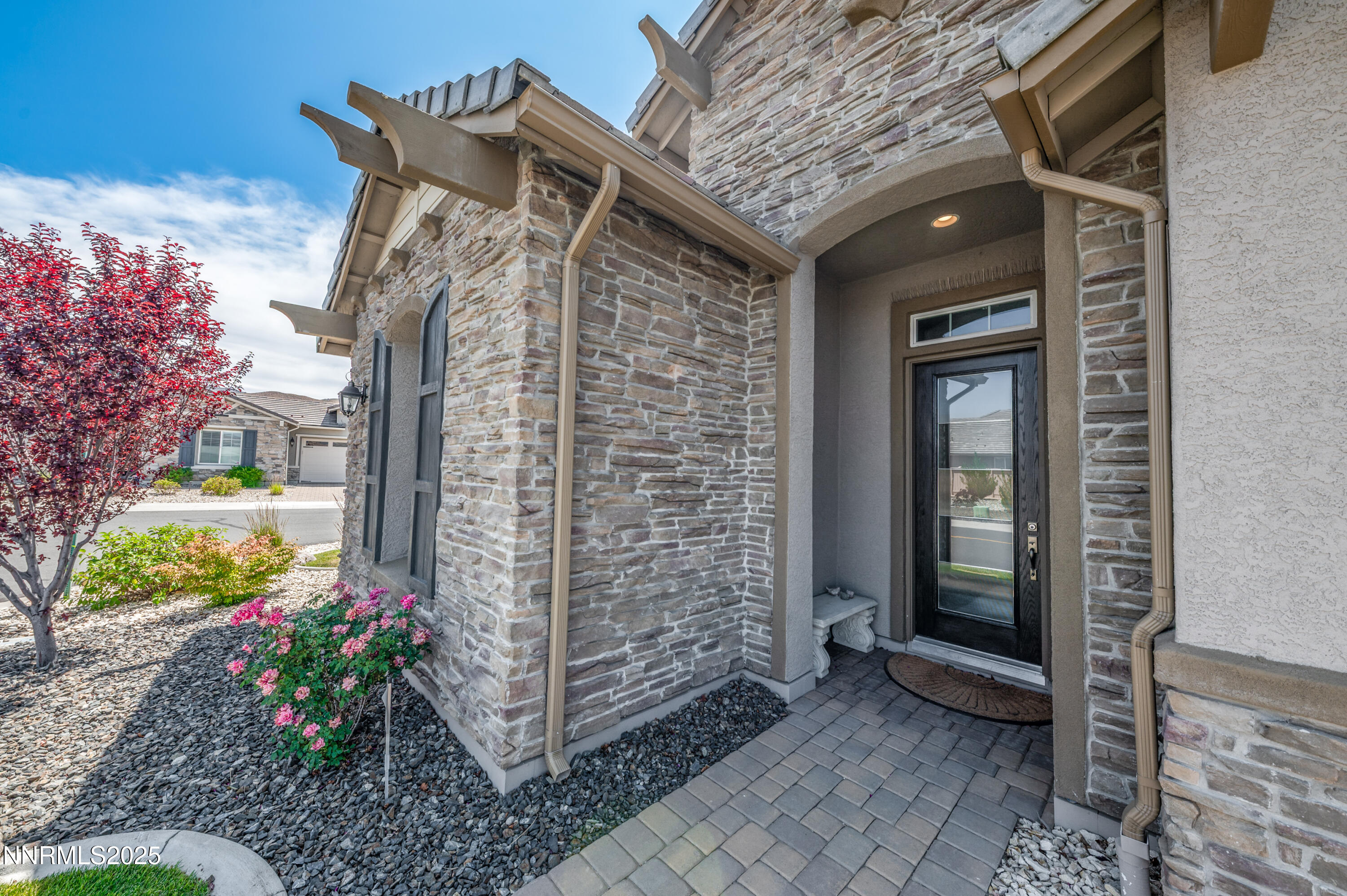 2300 Brego Lane Reno, NV 89521 - Photo 4 of 69 a front view of a house with a garden