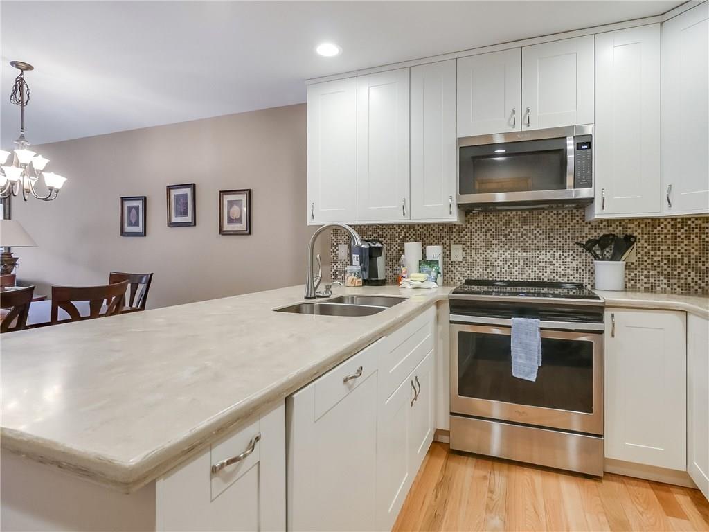 72 Oro Grande Road, Unit 212 Keystone, CO 80435 - Photo 2 of 21 a kitchen with stainless steel appliances a stove microwave and sink