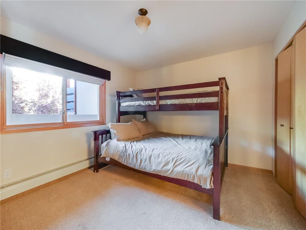 72 Oro Grande Road, Unit 212 Keystone, CO 80435 - Photo 11 of 21 a bedroom with a bed and a window