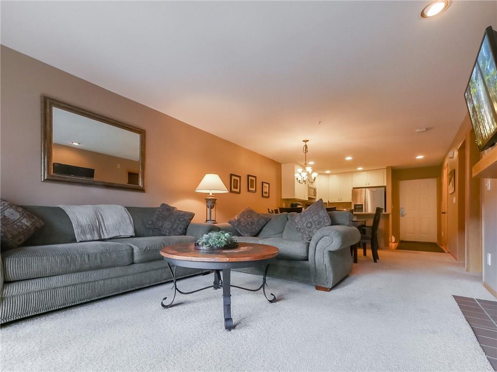 72 Oro Grande Road, Unit 212 Keystone, CO 80435 - Photo 13 of 21 a living room with furniture and a wooden floor