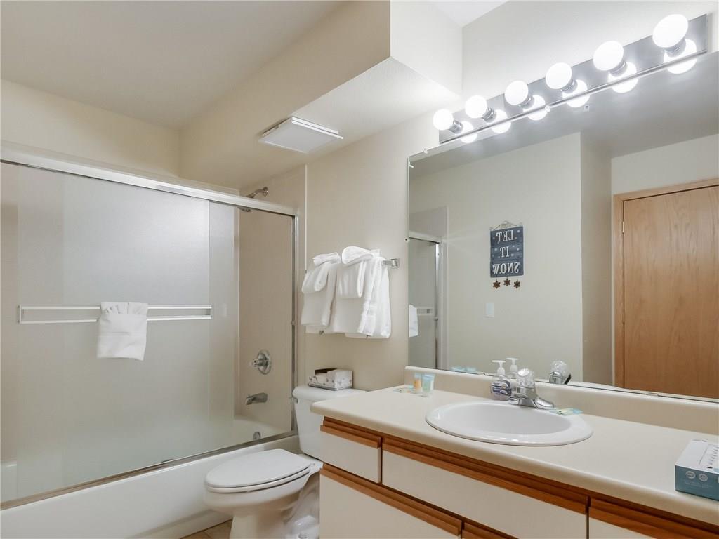 72 Oro Grande Road, Unit 212 Keystone, CO 80435 - Photo 14 of 21 a bathroom with a sink a toilet and shower