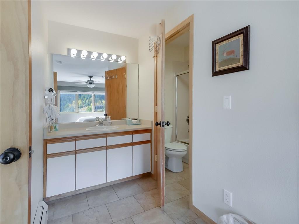 72 Oro Grande Road, Unit 212 Keystone, CO 80435 - Photo 15 of 21 a bathroom with a toilet sink and mirror