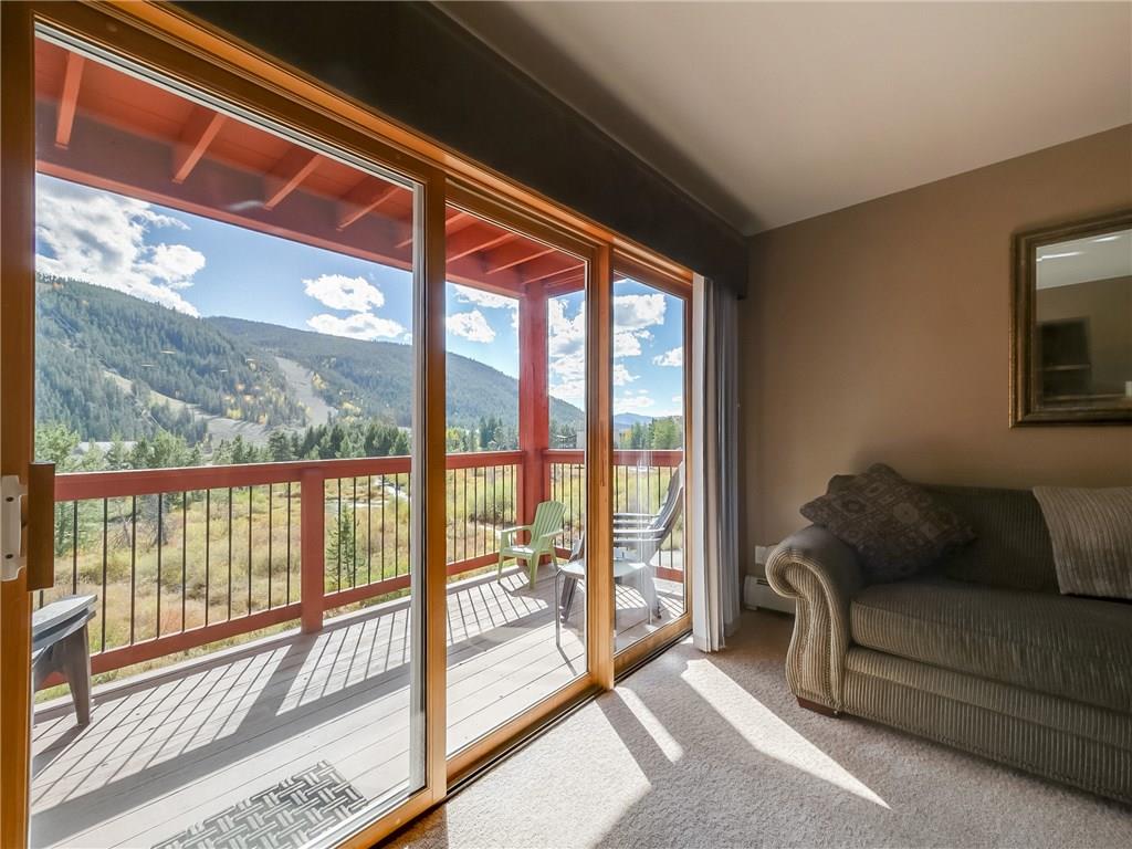 72 Oro Grande Road, Unit 212 Keystone, CO 80435 - Photo 16 of 21 a living room with furniture and a floor to ceiling window