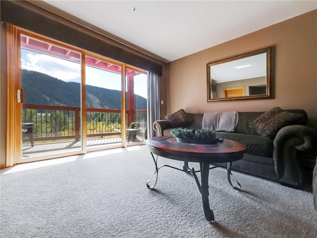 72 Oro Grande Road, Unit 212 Keystone, CO 80435 - Photo 3 of 21 a living room with furniture and a large window