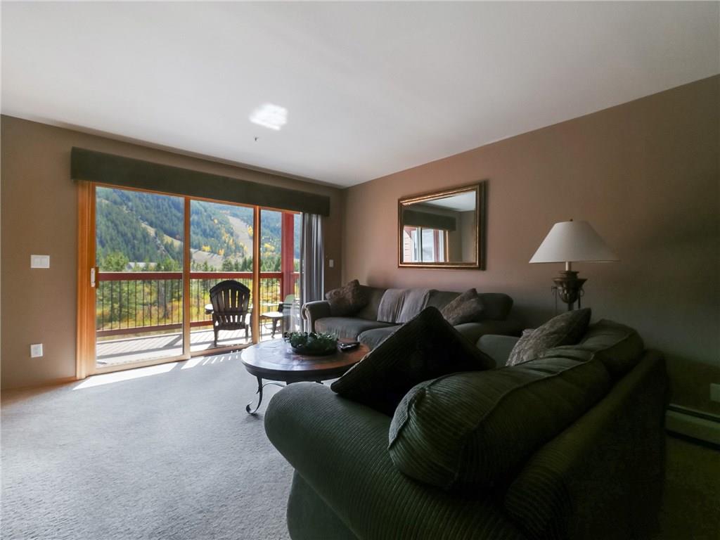 72 Oro Grande Road, Unit 212 Keystone, CO 80435 - Photo 6 of 21 a living room with furniture and a large window