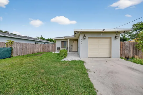 a view of a back yard of the house