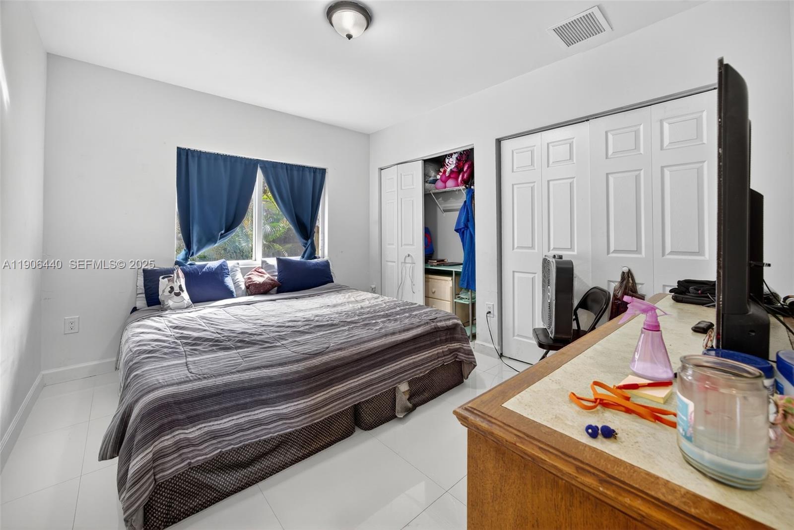 344 Southwest 3rd Street Florida City, FL 33034 - Photo 11 of 35 a bedroom with bed and a window