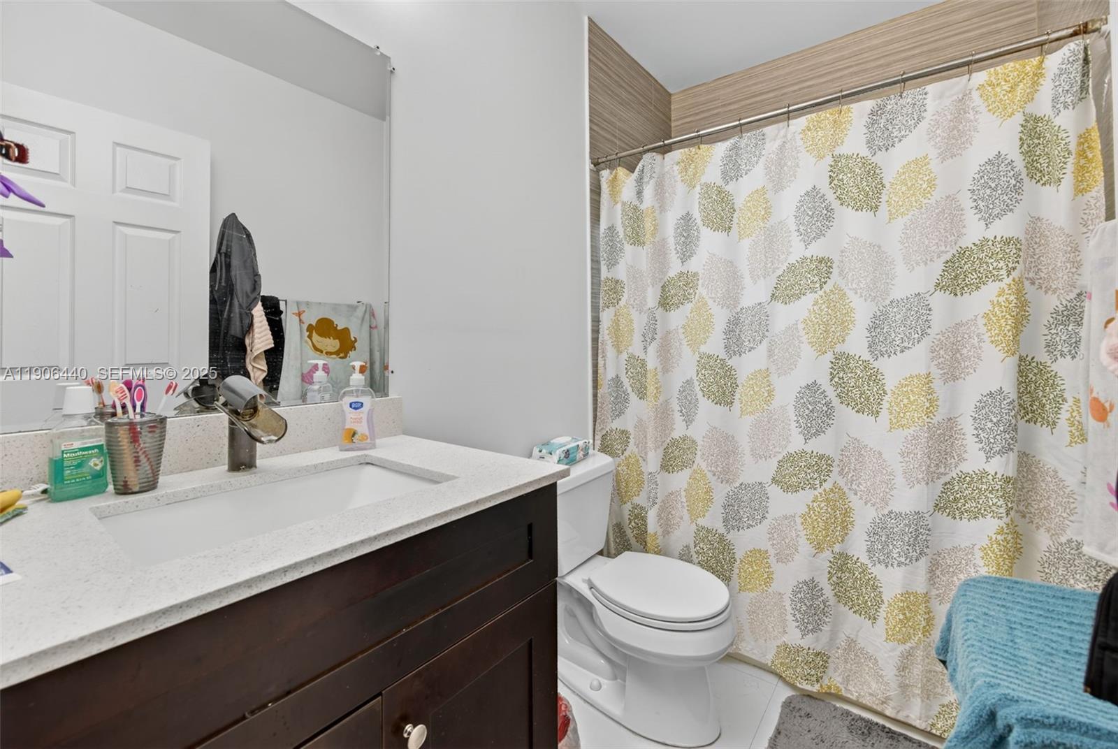 344 Southwest 3rd Street Florida City, FL 33034 - Photo 13 of 35 a bathroom with a sink and a mirror