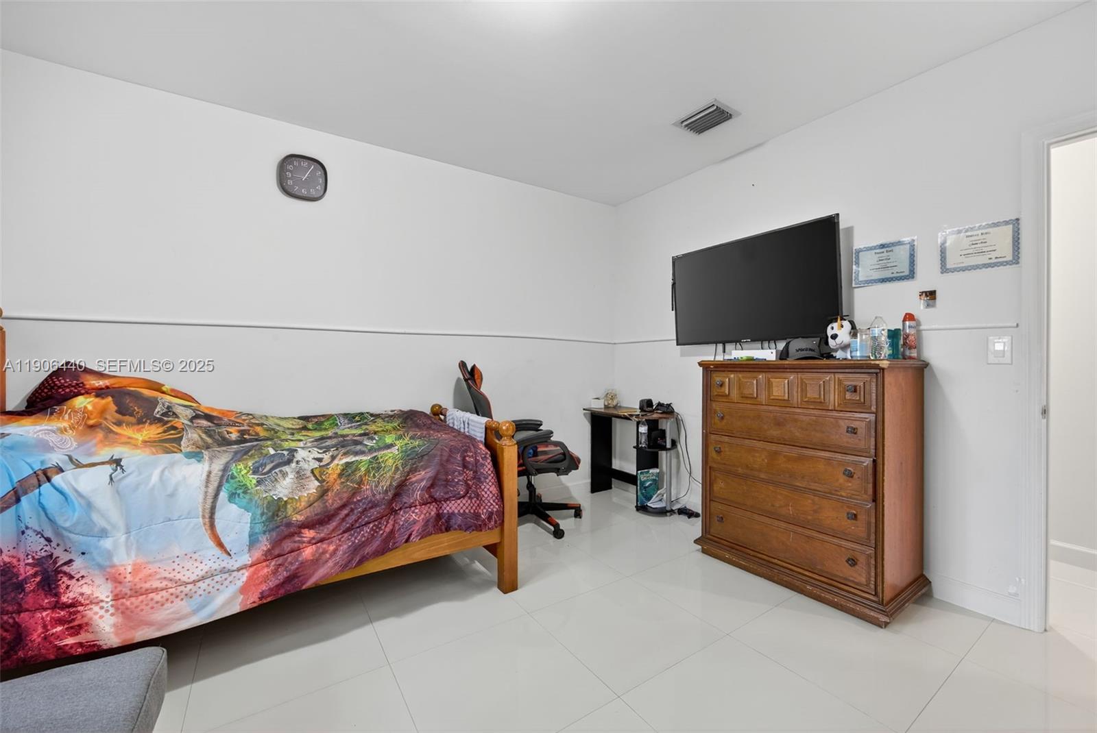 344 Southwest 3rd Street Florida City, FL 33034 - Photo 21 of 35 a bedroom with a bed and flat screen tv