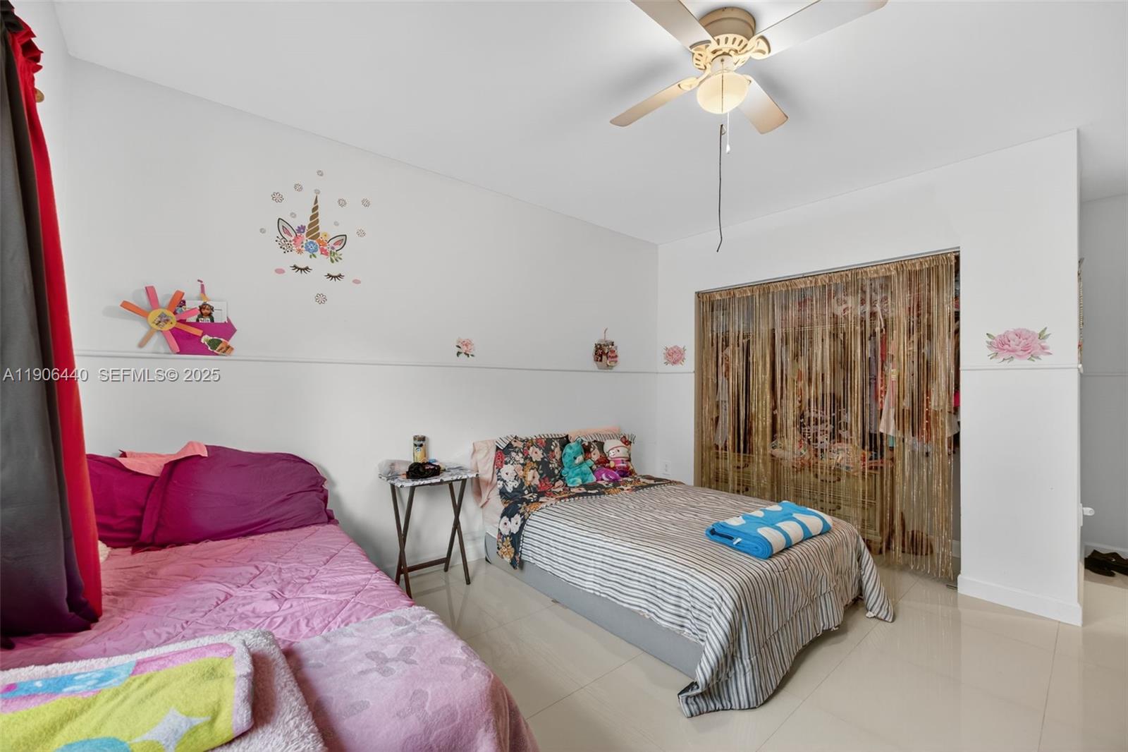 344 Southwest 3rd Street Florida City, FL 33034 - Photo 25 of 35 a bedroom with a bed chandelier and a window