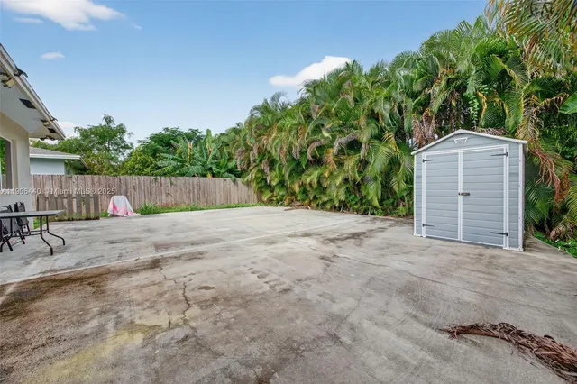 a view of a house with a yard and garage
