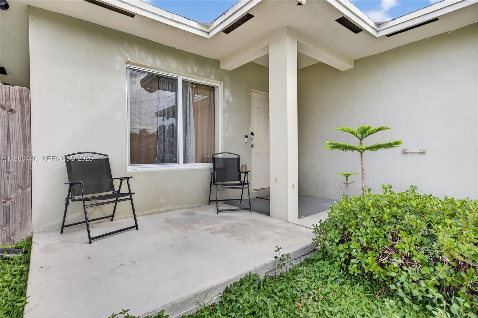 344 Southwest 3rd Street Florida City, FL 33034 - Photo 5 of 35 a living room with furniture and a potted plant