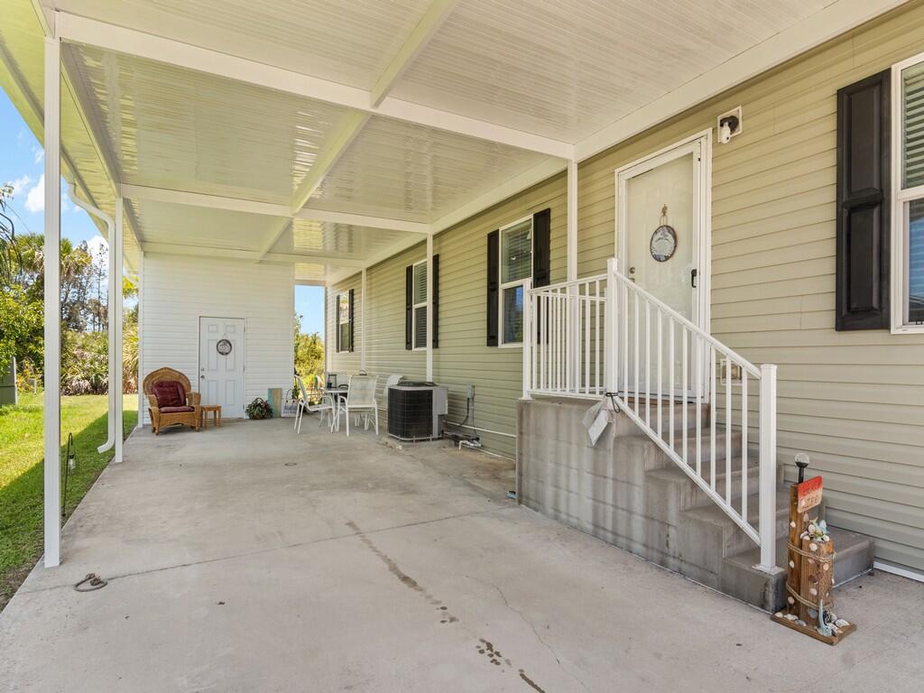 309 Mockingbird Avenue Fort Pierce, FL 34982 - Photo 14 of 22 Carport/entrance