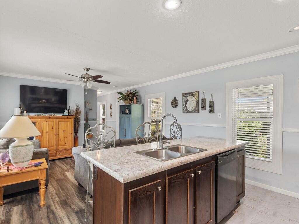 309 Mockingbird Avenue Fort Pierce, FL 34982 - Photo 5 of 22 Kitchen and Living Room