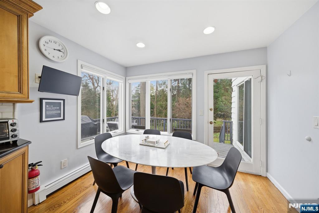 126 Sussex Road Tenafly, NJ 07670 - Photo 13 of 50 a dining room with furniture a rug and wooden floor