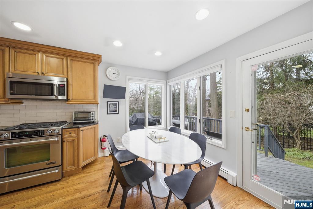 126 Sussex Road Tenafly, NJ 07670 - Photo 17 of 50 a view of a dining room with furniture window and wooden floor