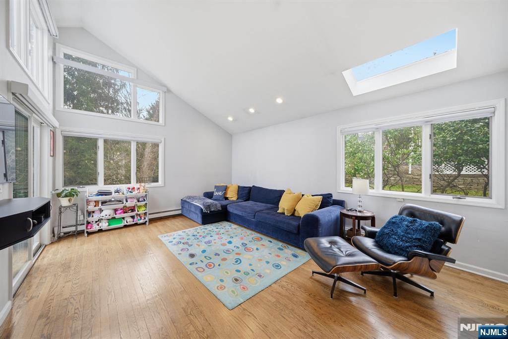 126 Sussex Road Tenafly, NJ 07670 - Photo 18 of 50 a living room with furniture and large windows