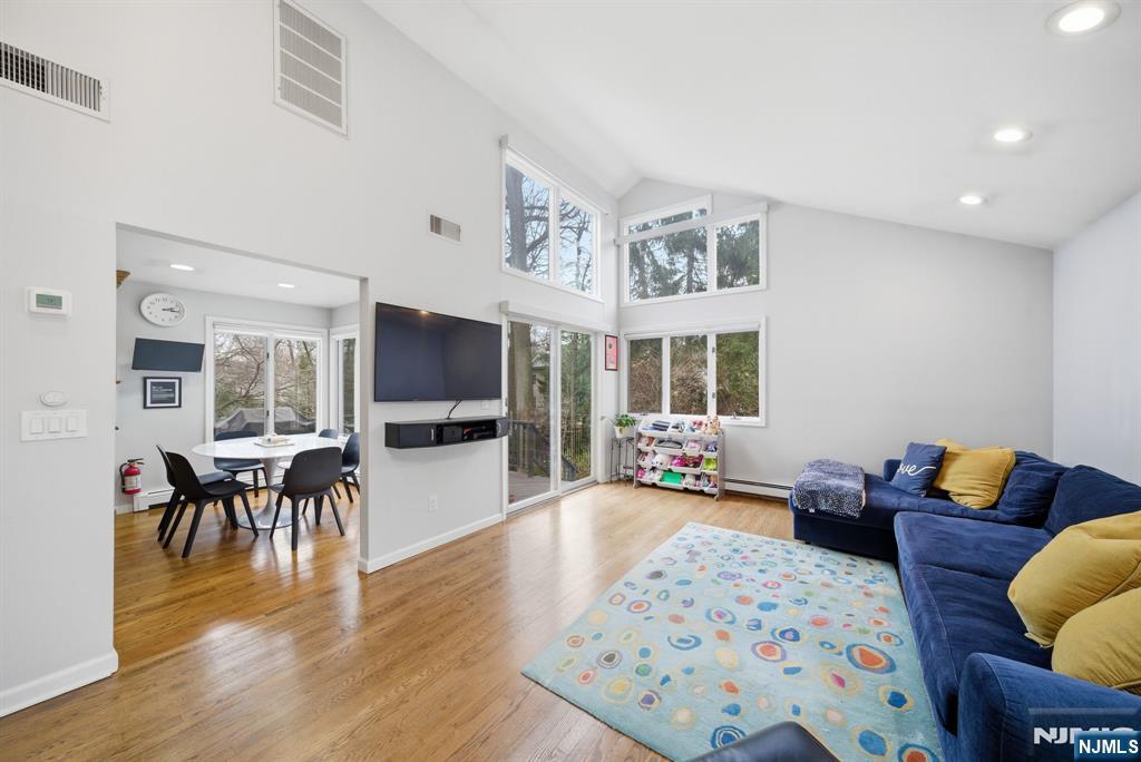 126 Sussex Road Tenafly, NJ 07670 - Photo 19 of 50 a living room with furniture and a flat screen tv