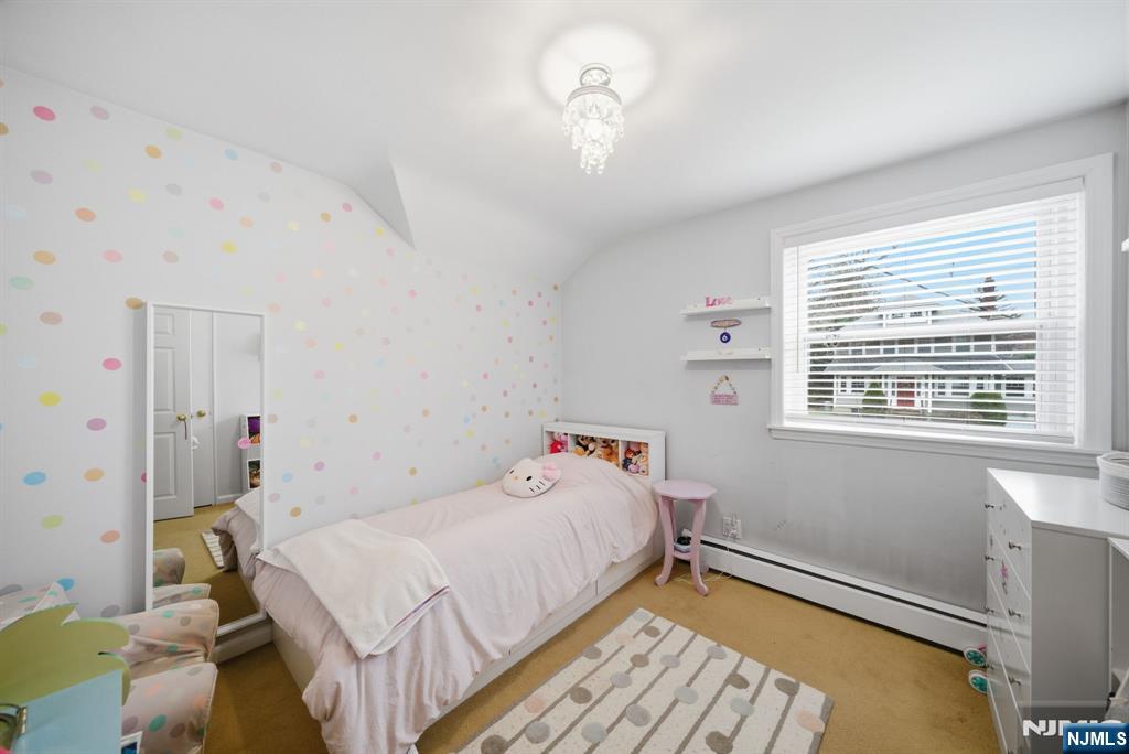 126 Sussex Road Tenafly, NJ 07670 - Photo 30 of 50 a bedroom with a bed and a window