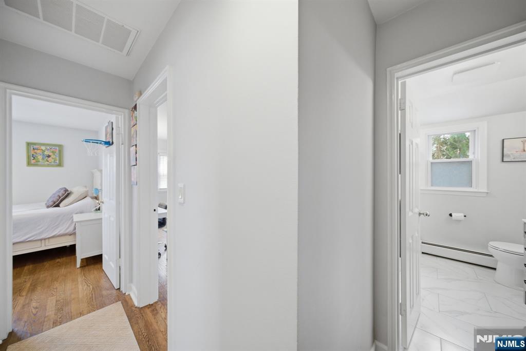 126 Sussex Road Tenafly, NJ 07670 - Photo 32 of 50 a view of a bedroom from a hallway