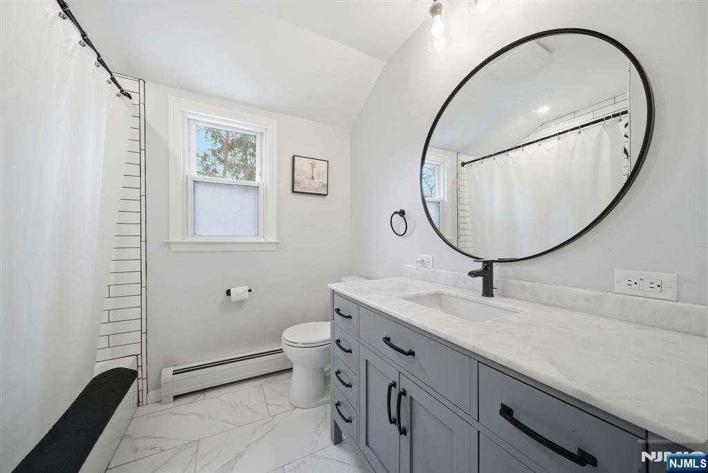 126 Sussex Road Tenafly, NJ 07670 - Photo 33 of 50 a bathroom with a sink a vanity and a mirror