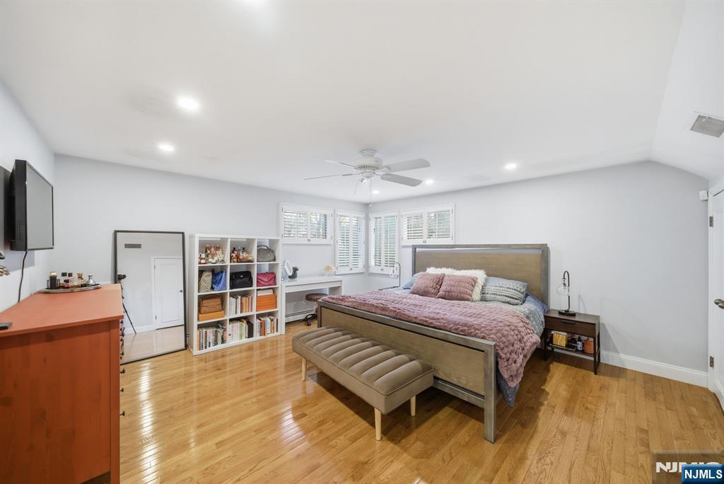 126 Sussex Road Tenafly, NJ 07670 - Photo 35 of 50 a bedroom with a bed furniture and a flat screen tv