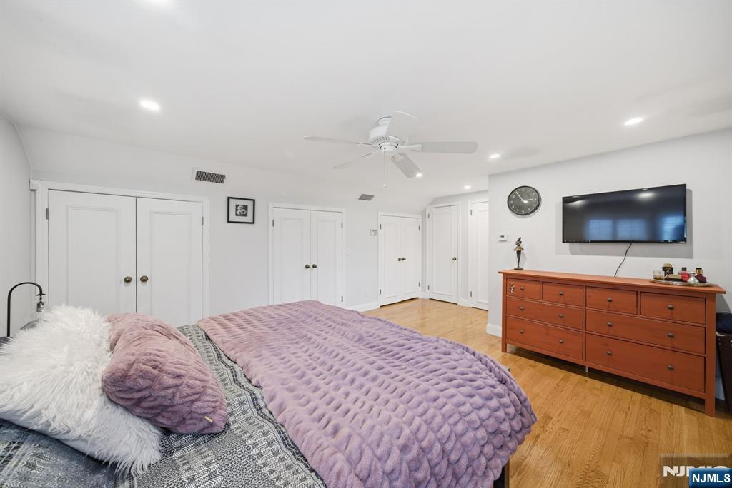126 Sussex Road Tenafly, NJ 07670 - Photo 38 of 50 a bedroom with a bed and a flat screen tv