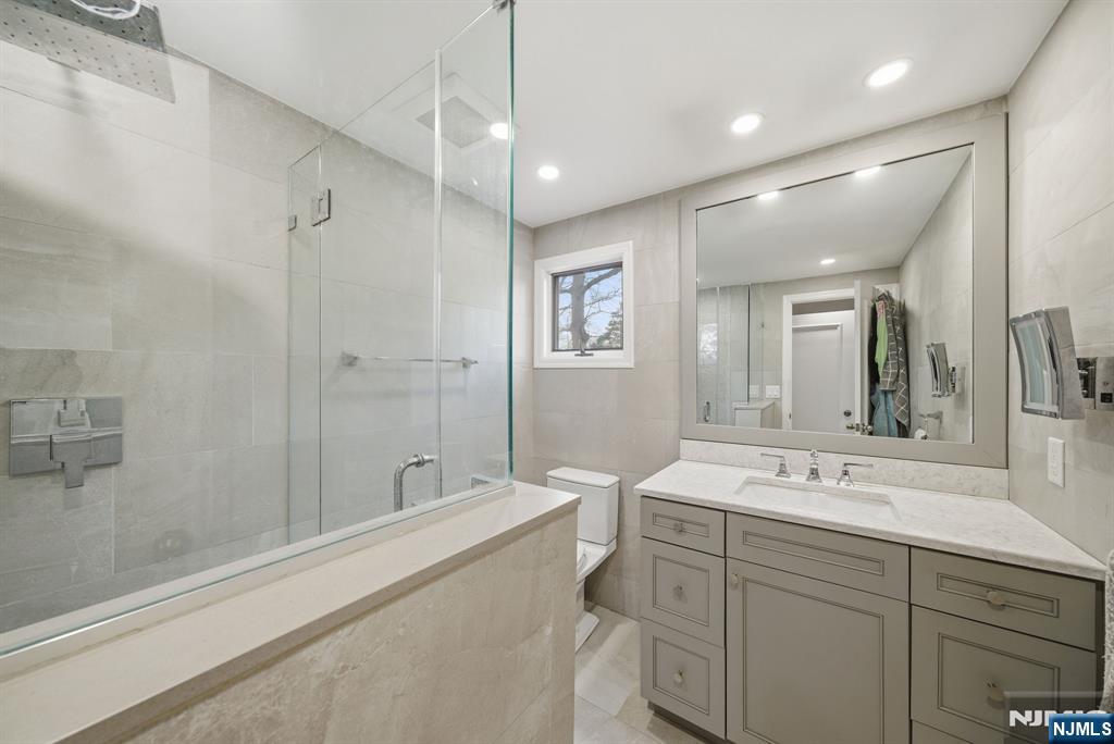126 Sussex Road Tenafly, NJ 07670 - Photo 41 of 50 a spacious bathroom with a double vanity sink mirror and double