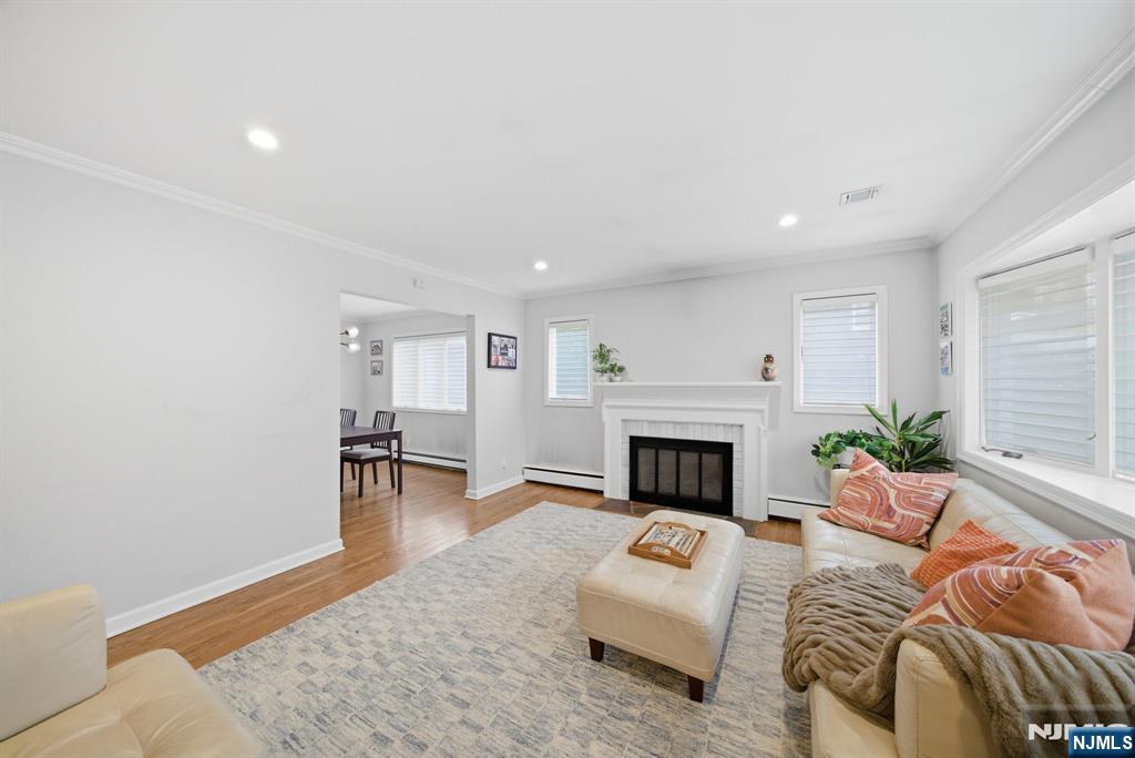 126 Sussex Road Tenafly, NJ 07670 - Photo 5 of 50 a living room with furniture and a fireplace