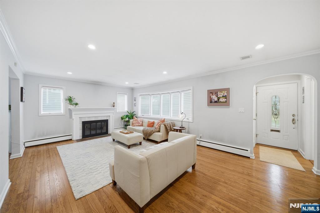 126 Sussex Road Tenafly, NJ 07670 - Photo 6 of 50 a living room with furniture and a fireplace