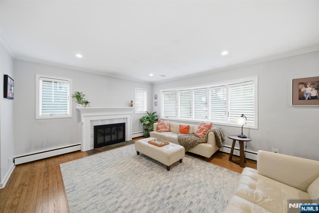 126 Sussex Road Tenafly, NJ 07670 - Photo 7 of 50 a living room with furniture and a fireplace