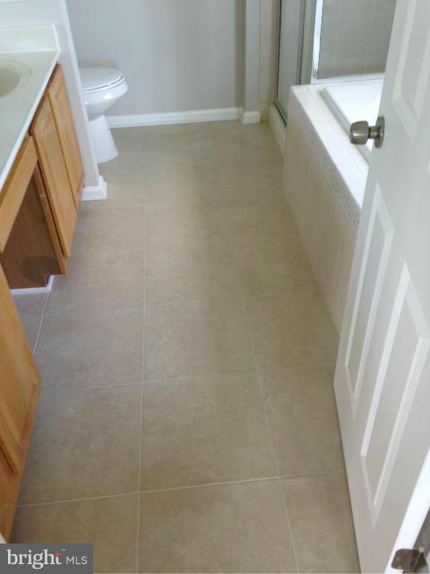 3004 Kidder Road Clinton, MD 20735 - Photo 13 of 23 a bathroom with a granite countertop shower and a sink