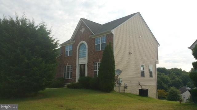 3004 Kidder Road Clinton, MD 20735 - Photo 3 of 23 a front view of a house with a yard
