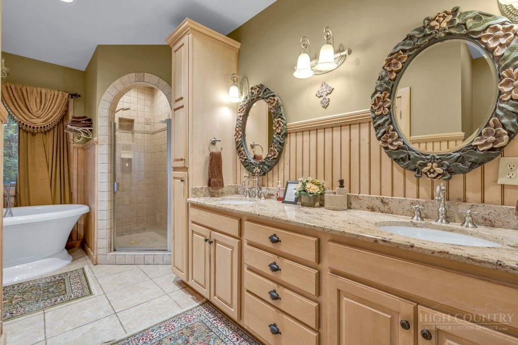 160 Outback Road Ferguson, NC 28624 - Photo 42 of 49 a spacious bathroom with a mirror and a sink