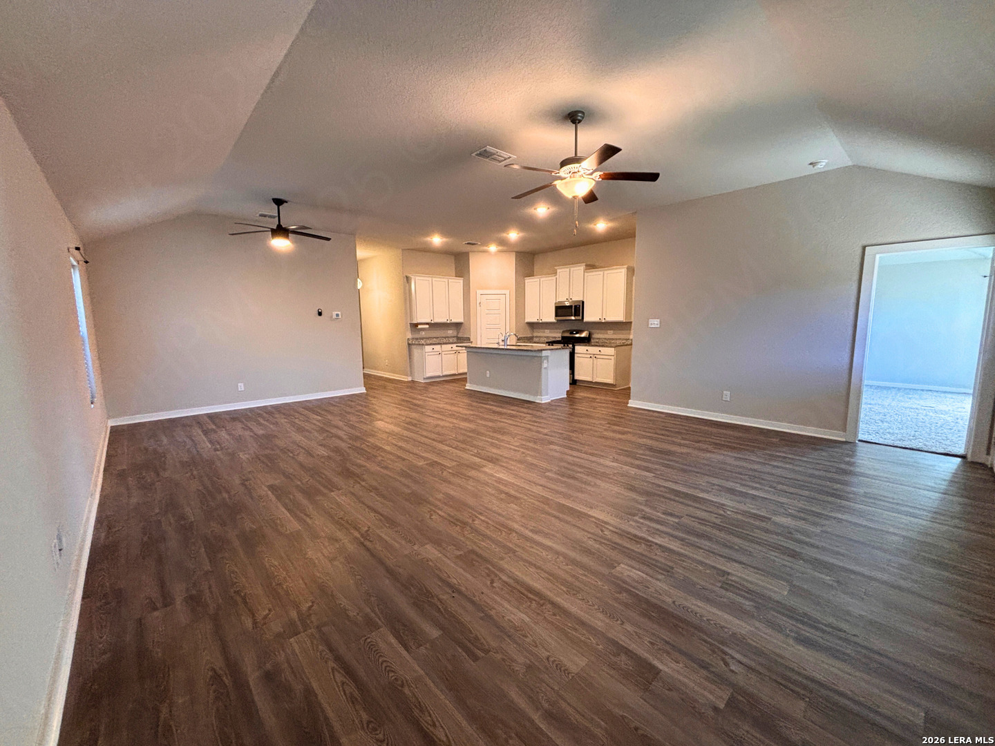 10754 Francisco Way Converse, TX 78109 - Photo 13 of 18 wooden floor in an empty room with a window
