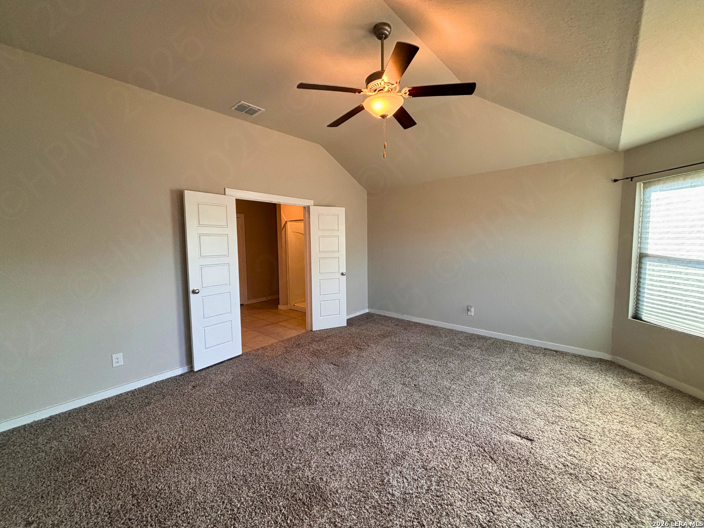 10754 Francisco Way Converse, TX 78109 - Photo 14 of 18 a view of a livingroom with a ceiling fan and window