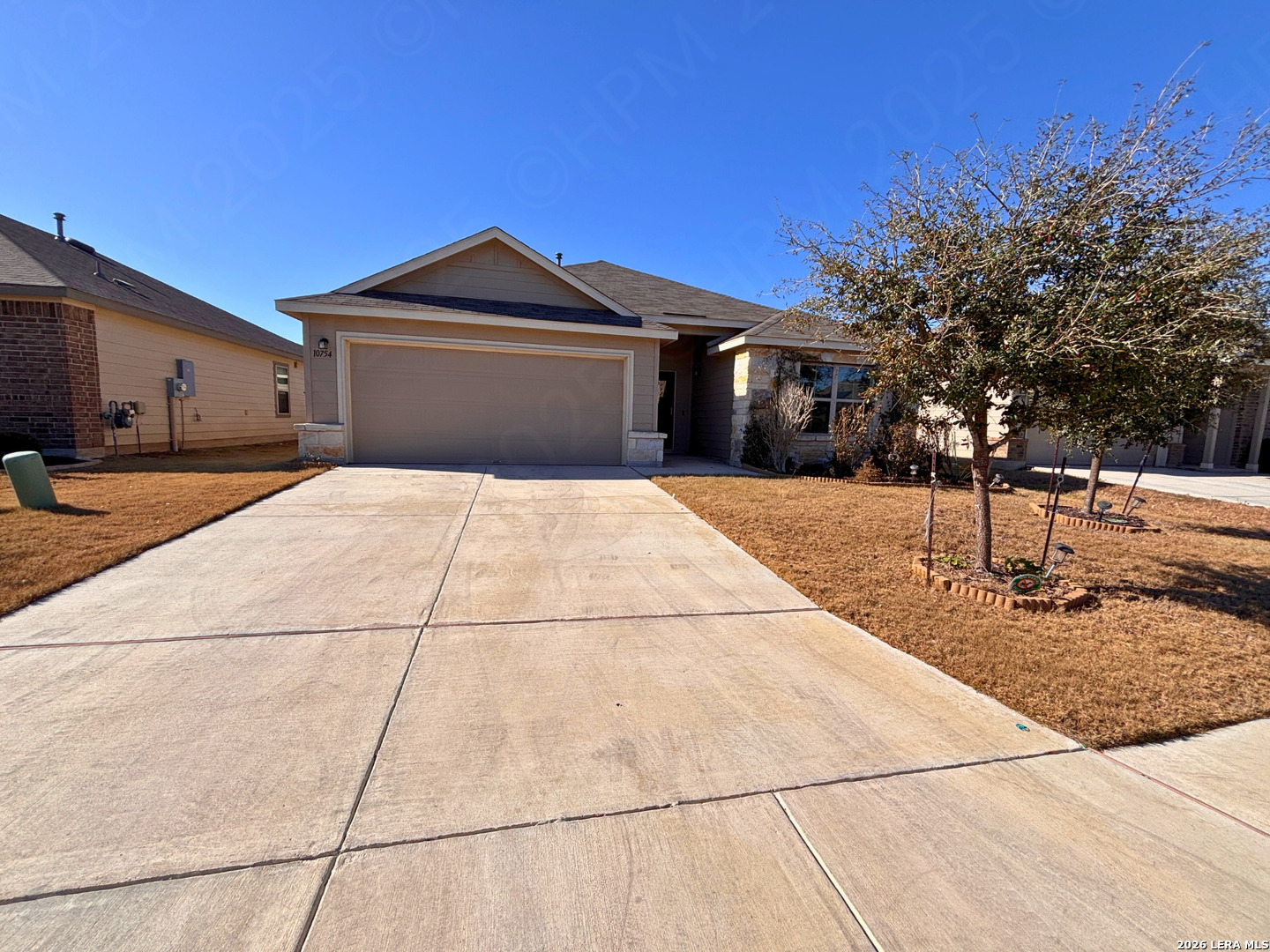 10754 Francisco Way Converse, TX 78109 - Photo 2 of 18 a backyard of a house with yard and garage