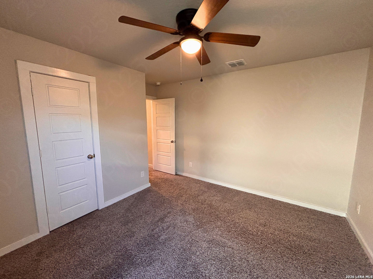 10754 Francisco Way Converse, TX 78109 - Photo 6 of 18 an empty room with closet and fan