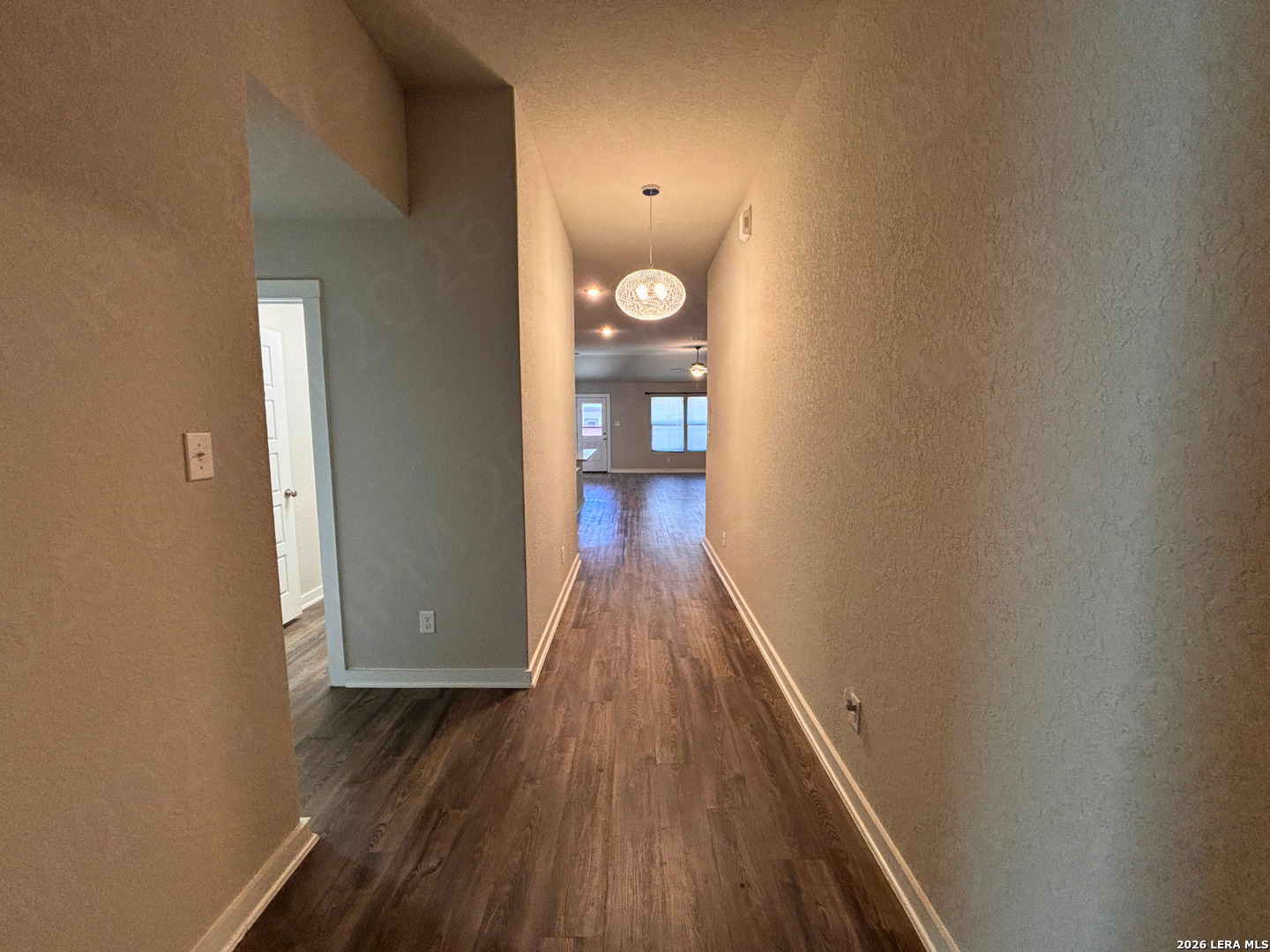10754 Francisco Way Converse, TX 78109 - Photo 7 of 18 a view of a hallway with wooden floor