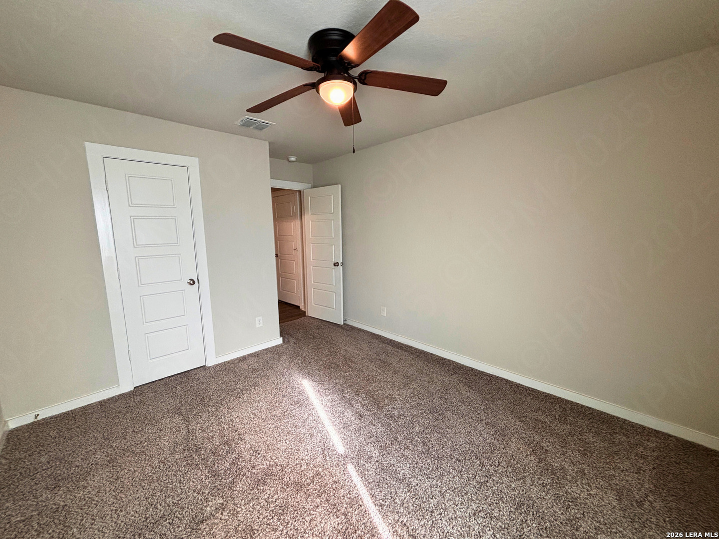 10754 Francisco Way Converse, TX 78109 - Photo 8 of 18 an empty room with chandelier fan