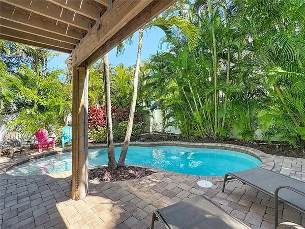 a bathroom with a granite countertop sink a toilet and a mirror