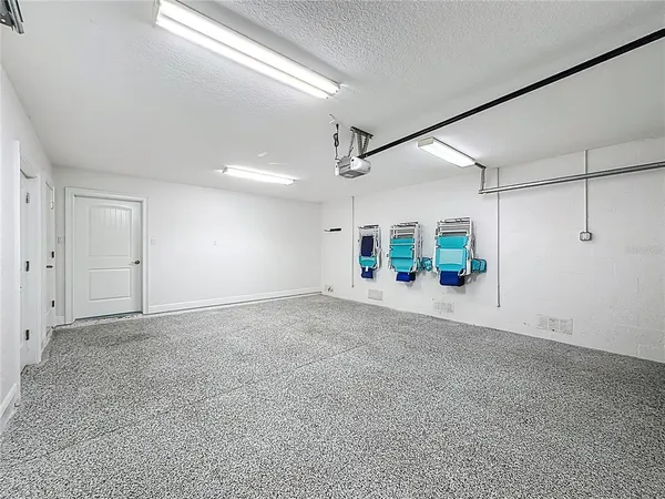 a kitchen with stainless steel appliances granite countertop a stove a sink a dining table and chairs