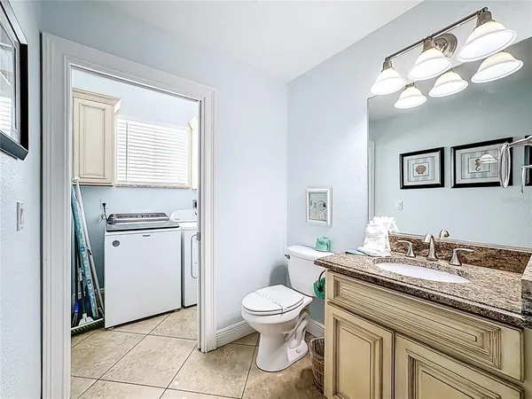 a kitchen with a stove a sink a microwave and a dining table