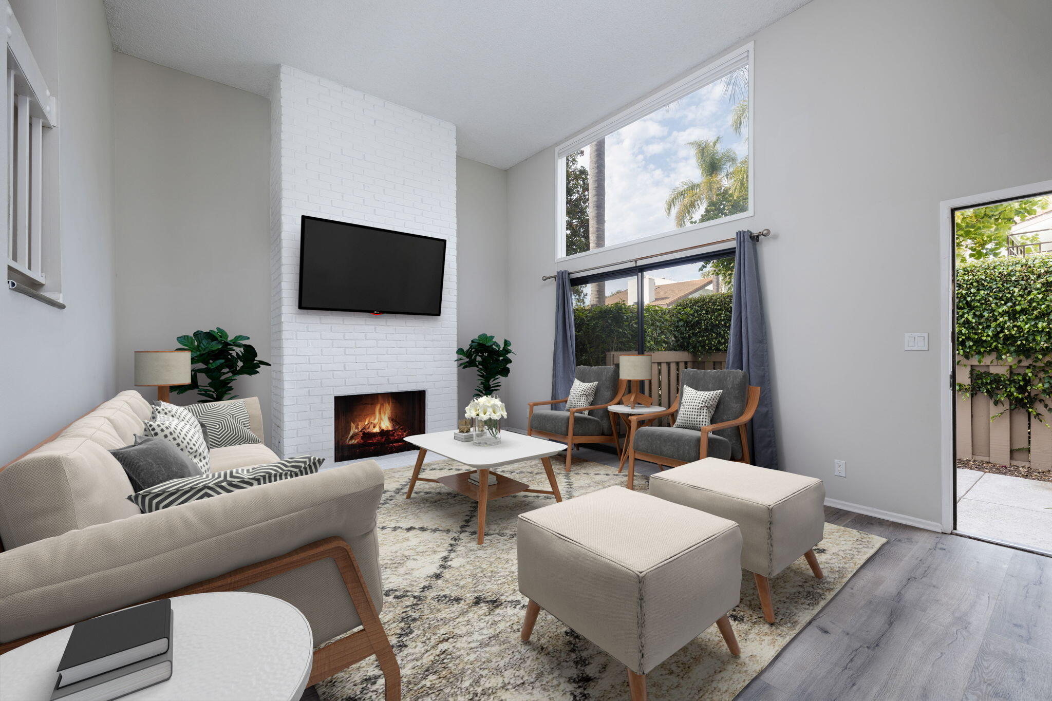 a living room with furniture a fireplace and a flat screen tv